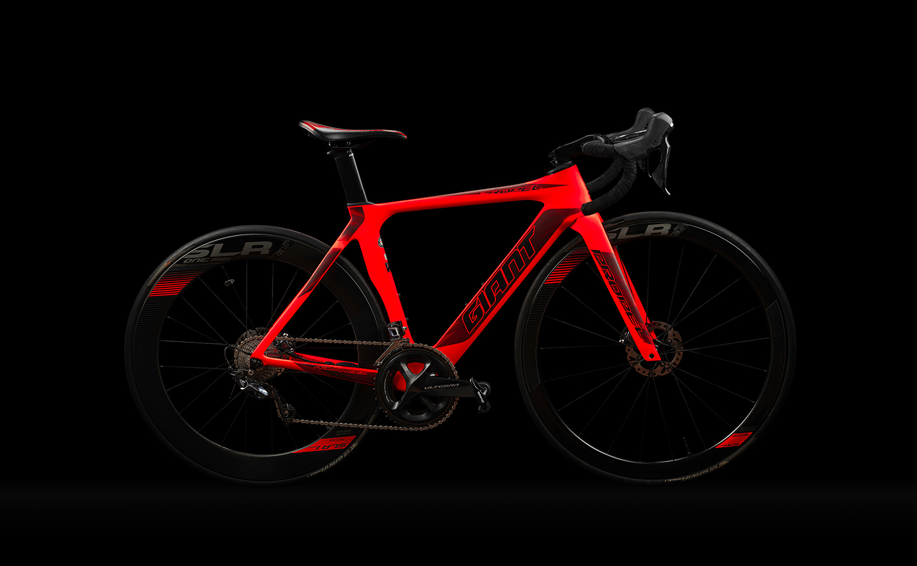 A side view of the Giant road bike on a black background