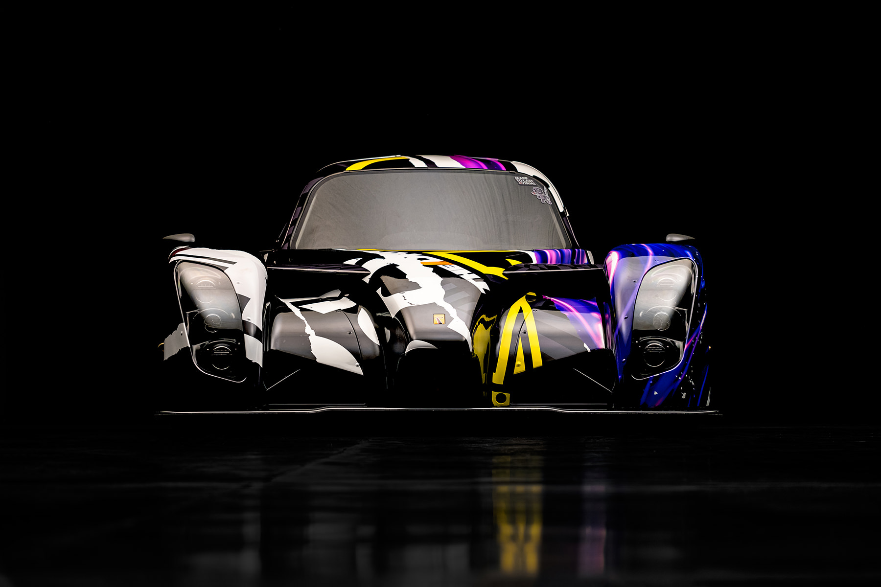 A front view of the livery graphics for the Radical RXC racecar
